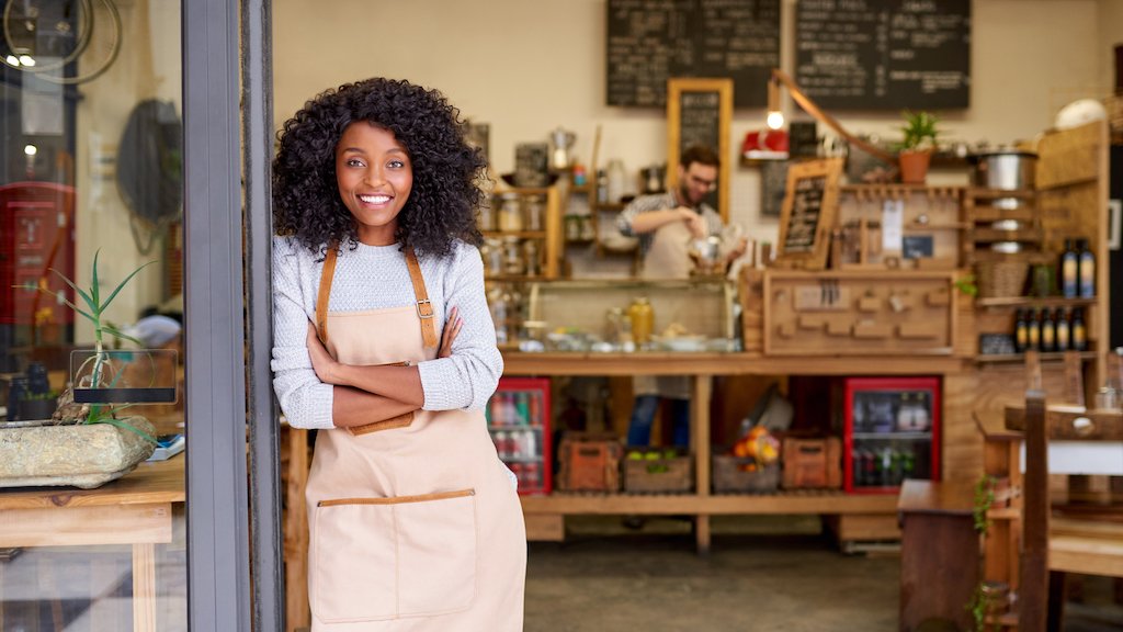 Portrait of a smiling young African American barista